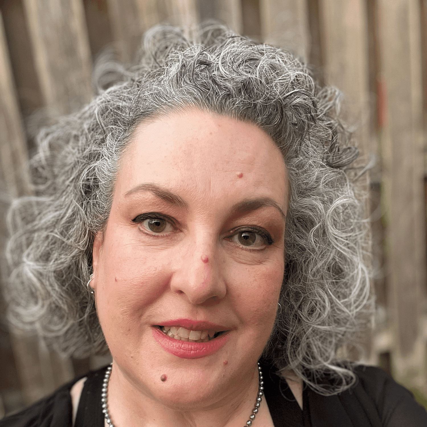 Portrait of Lori, a professional stylist at Spa 309 Salon & Boutique, showcasing their expertise and style.