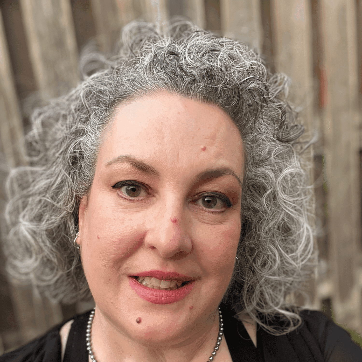 Portrait of Lori, a professional stylist at Spa 309 Salon & Boutique, showcasing their expertise and style.