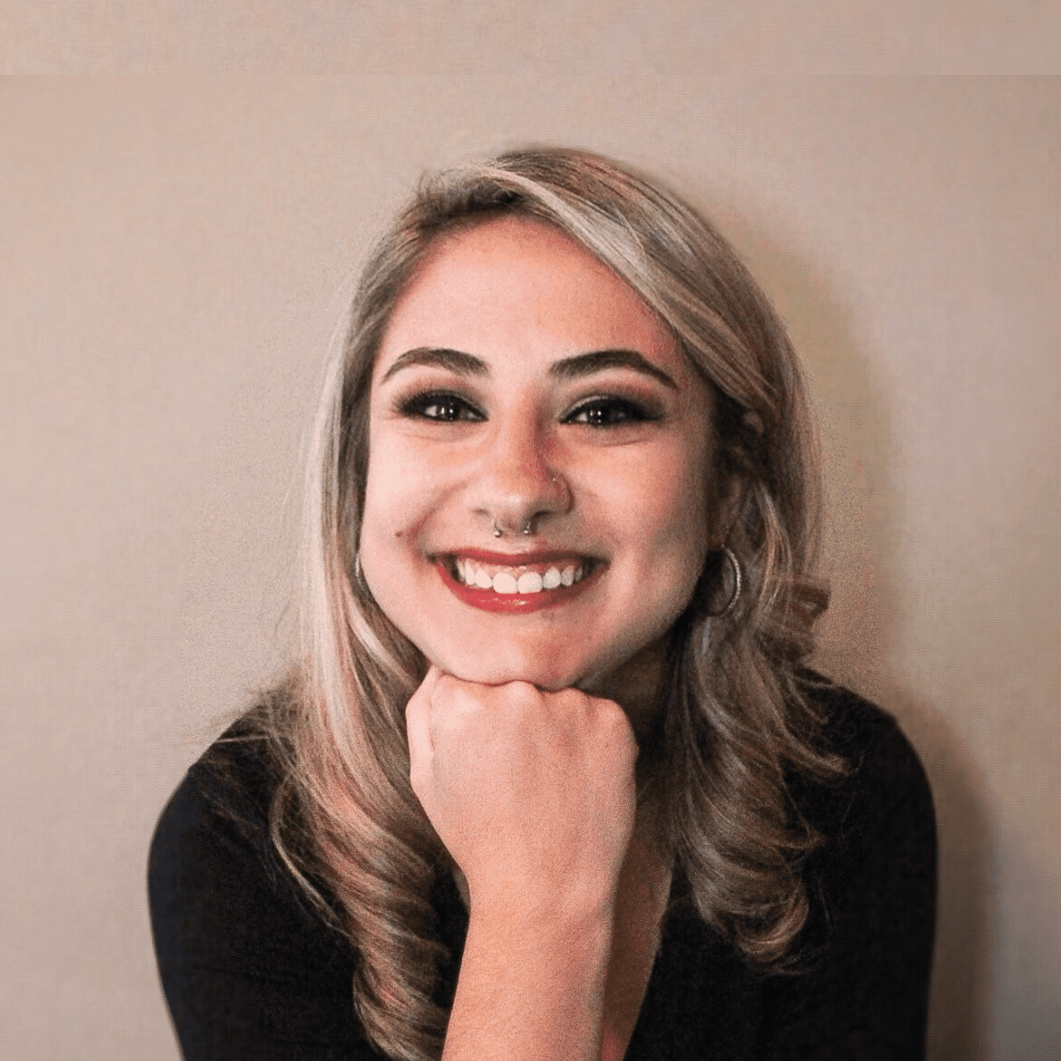 Portrait of Mariah, a professional stylist at Spa 309 Salon & Boutique, showcasing their expertise and style.